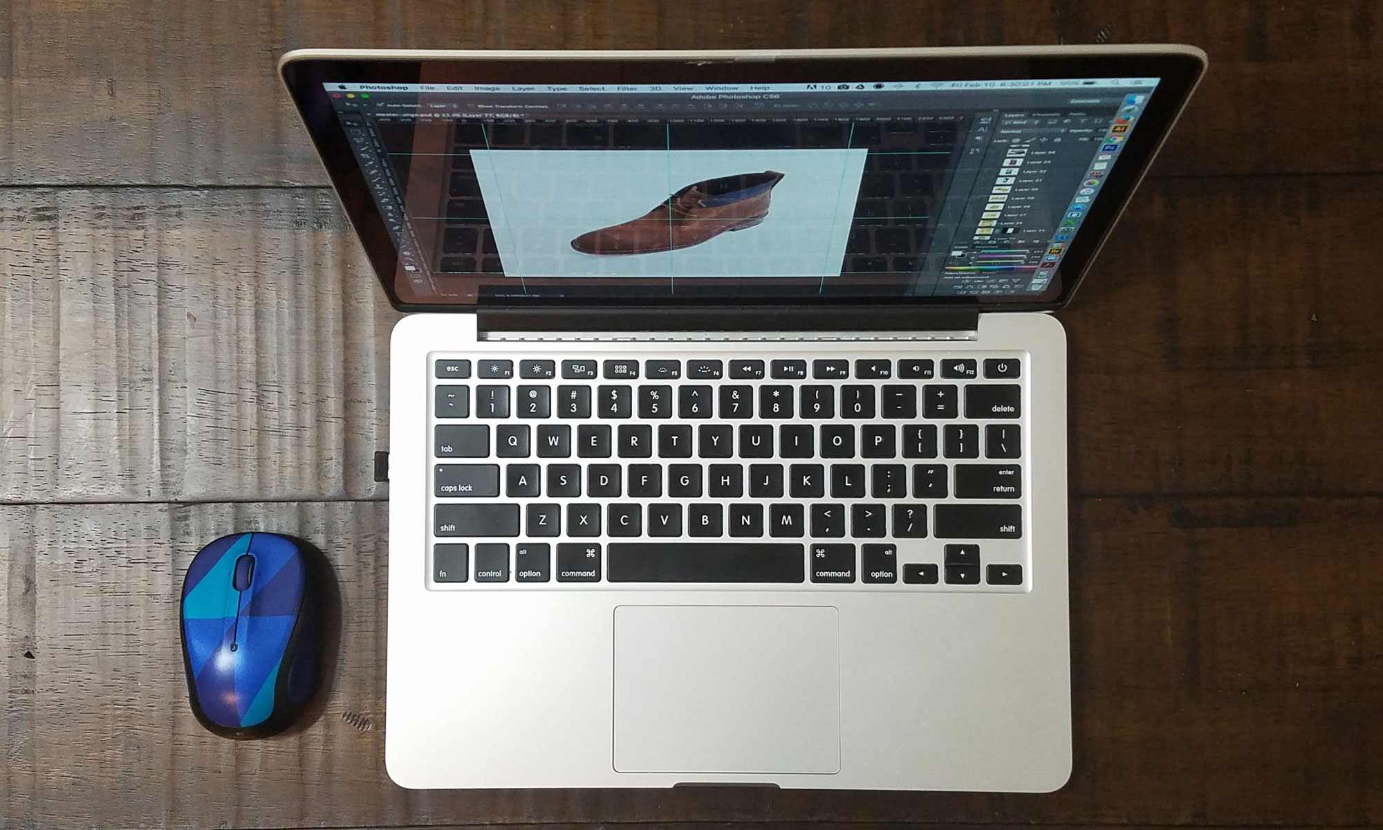 Apple Macbook and mouse on table